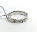 An 18ct white gold wishbone ring set with single r