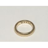 An 18carat gold wedding band weight 7g Ring size K