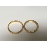 Two 22carat gold wedding bands weight 6g ring size