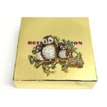 A boxed Butler & Wilson brooch in the style of thr