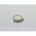 A 9ct gold ring set with 4 emeralds and 4 diamonds