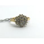 An 18ct yellow gold diamond cluster ring, approx 0