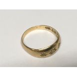 An 18carat gold ring set with three small diamonds