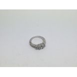 A 10ct white gold ring set with 3 moissanite stone