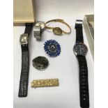 A small box containing dress watches and costume j