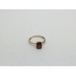 A 9ct gold ring set with a faceted Ruby. Size n ap