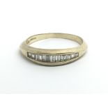 A 9ct yellow gold emerald cut diamond, approx 0.25