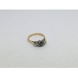 An 18ct gold ring set with 2 diamonds and 4 sapphi