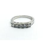 An 18ct white gold ring with a row of five diamond