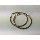 A pair large 9ct gold hoop earringS.