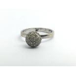 An 18ct white gold and diamond cluster ring, appro