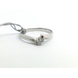 A 9ct white gold ring set with 10 point diamond so