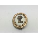 A quality George III gold portrait brooch signed M