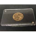 A gold full sovereign dated 1899 in a fitted case.