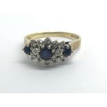 An 18ct yellow gold sapphire and diamond cluster r