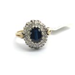 An 18ct yellow gold sapphire and diamond cluster r