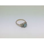 A 9ct gold ring set with topaz and aqua marine 5 s