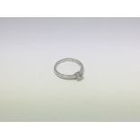A 9ct white gold ring set with 0.25ct solitaire di
