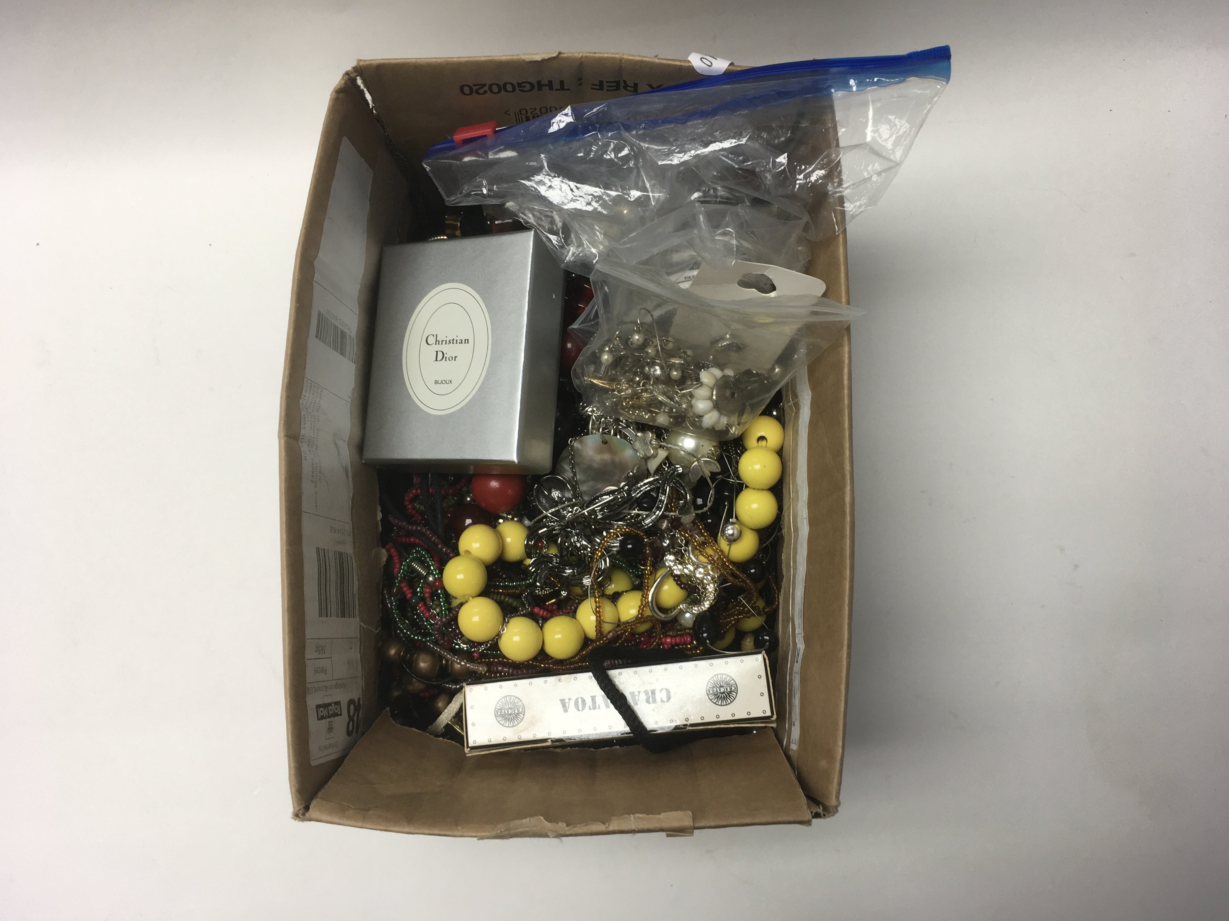 A box of costume jewellery including some new item