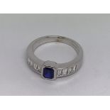 An 18ct white gold sapphire and channel-set diamon