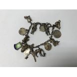 A silver charm bracelet approx 34g.