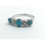 An 18ct white gold ring set with three turquoise s