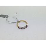 An 18ct gold ring set with 5 Ruby's and 4 diamonds