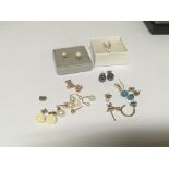 A collection of earrings some gold and set with pe