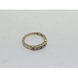 A 9ct gold ring set with 5 diamonds approx 0.25ct.