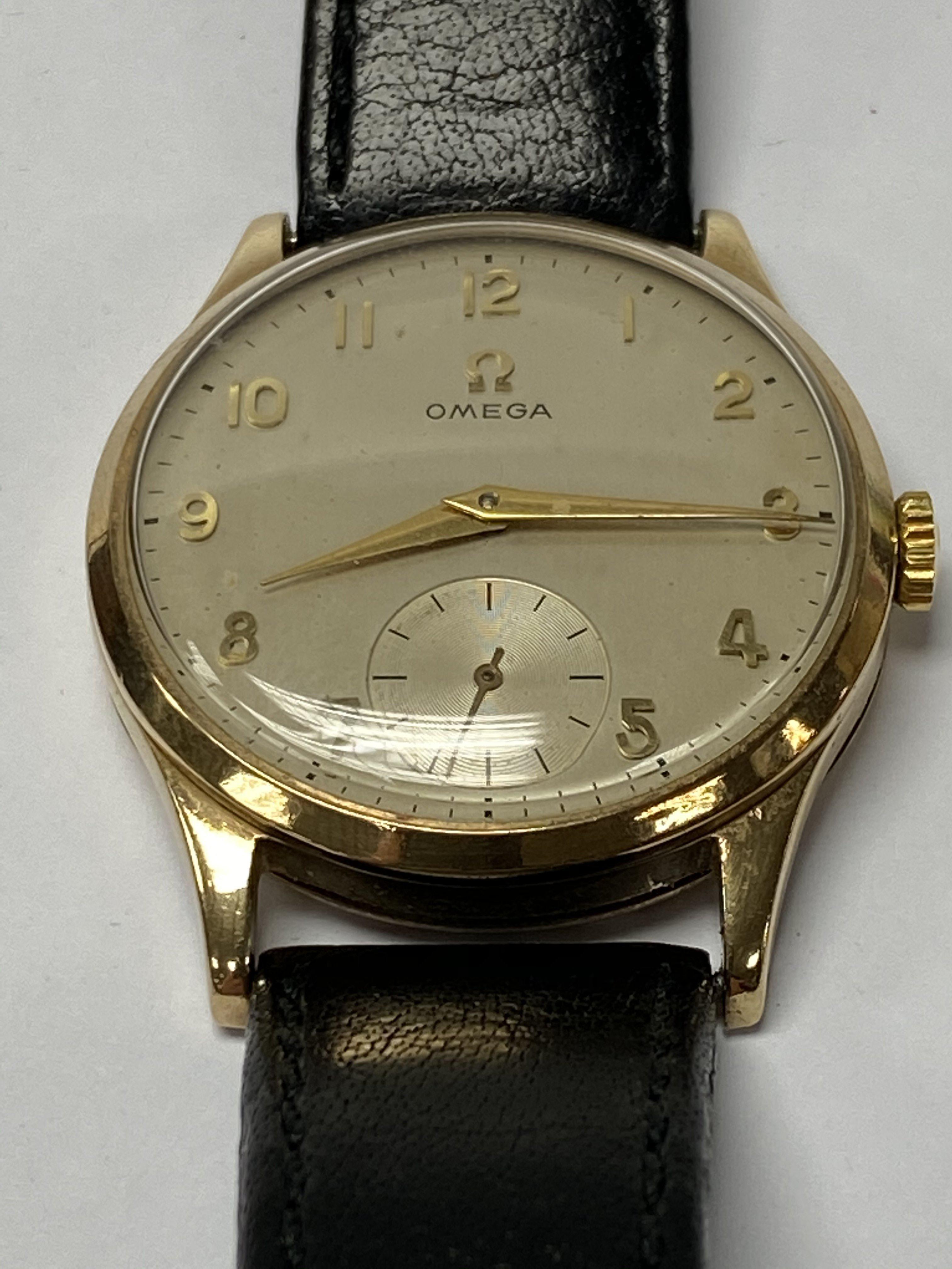 A gents 9ct gold cased Omega wristwatch, engraving