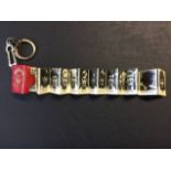 1971 Coffer Manchester United Football Keyring: Fold out pictures of the players from Northampton