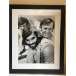 George Best Large Signed Framed Photo: George Best with Pat Crerand and Lou Macari. Black and