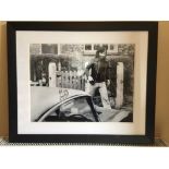 George Best Large Framed Photograph: Depicting George Best leaving his house in Manchester. Black