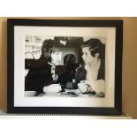 George Best Signed Framed Photo: Depicting George in conversation with a girl. Black and white