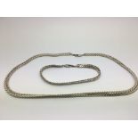 A silver necklace and matching bracelet (2) - NO R