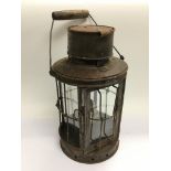 An antique lamp with paraffin burner.