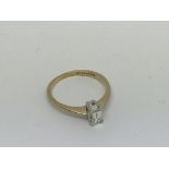 A 9ct gold ring set with emerald cut diamond Appro