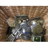 A basket containing costume jewellery silver spoons and objects various.
