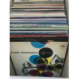 A box of Jazz LPs by various artists including Zoot Sims, Vic Damone, Bill Evans and others.