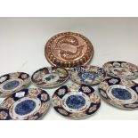 A collection of late 19th century Imari plates and a 20th century copper jelly mould.