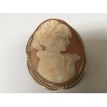 An unmarked gold cameo brooch. A side profile port