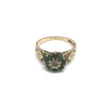 A 9ct gold ring set with green stones, approx 3.2g