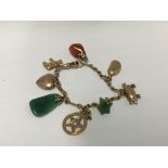 A small 9ct charm bracelet with charms including a