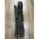 A large African ebony carving of 4 natives, 85cm.