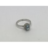 A 14ct white gold ring set with an aquamarine and