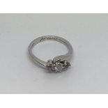 An 18ct white gold ring set with 2 pink sapphires