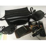 A collection of old vintage camera equipment (a lo