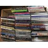 A box of CDs by various artists including Bob Dyla