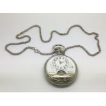 A silver cased pocket watch with visible dial.