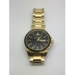 A gold tone Vivienne Westwood watch with baton num